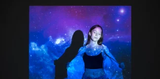 young-woman-standing-universe-texture-projection_23-2149512066